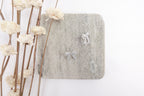 Silver Toned Pearl Bow Stud Earrings